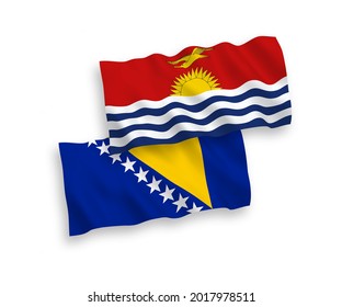 National vector fabric wave flags of Republic of Kiribati and Bosnia and Herzegovina isolated on white background. 1 to 2 proportion.