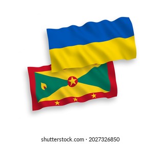 National vector fabric wave flags of Grenada and Ukraine isolated on white background. 1 to 2 proportion.