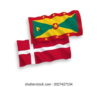 National vector fabric wave flags of Denmark and Grenada isolated on white background. 1 to 2 proportion.
