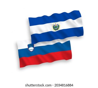 National vector fabric wave flags of Slovenia and Republic of El Salvador isolated on white background. 1 to 2 proportion.