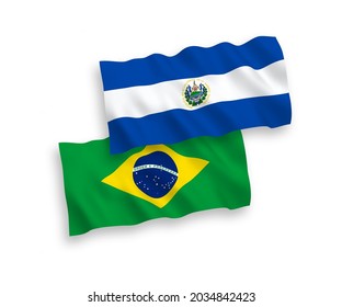 National vector fabric wave flags of Brazil and Republic of El Salvador isolated on white background. 1 to 2 proportion.