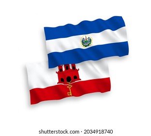 National vector fabric wave flags of Republic of El Salvador and Gibraltar isolated on white background. 1 to 2 proportion.