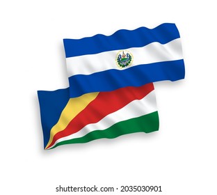 National vector fabric wave flags of Republic of El Salvador and Seychelles isolated on white background. 1 to 2 proportion.