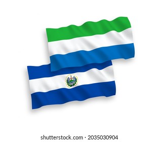 National vector fabric wave flags of Republic of El Salvador and Sierra Leone isolated on white background. 1 to 2 proportion.