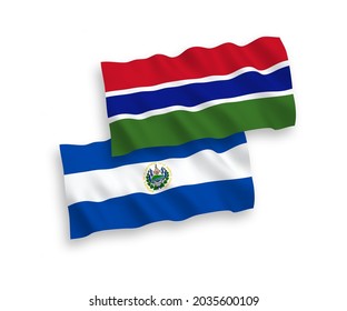 National vector fabric wave flags of Republic of El Salvador and Republic of Gambia isolated on white background. 1 to 2 proportion.