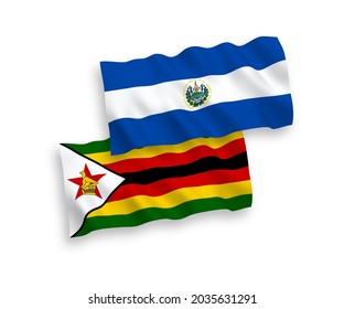 National vector fabric wave flags of Republic of El Salvador and Zimbabwe isolated on white background. 1 to 2 proportion.