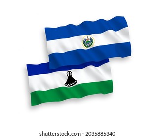 National vector fabric wave flags of Republic of El Salvador and Lesotho isolated on white background. 1 to 2 proportion.