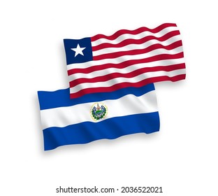 National vector fabric wave flags of Republic of El Salvador and Liberia isolated on white background. 1 to 2 proportion.