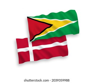 National vector fabric wave flags of Denmark and Co-operative Republic of Guyana isolated on white background. 1 to 2 proportion.