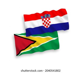 National vector fabric wave flags of Co-operative Republic of Guyana and Croatia isolated on white background. 1 to 2 proportion.