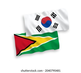 Banderas de olas de tela vectorial nacional de Corea del Sur y la República Cooperativa de Guyana aisladas en fondo blanco. de 1 a 2.