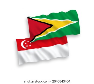 Banderas de olas de tela vectorial nacional de la República Cooperativa de Guyana y Singapur aisladas en fondo blanco. de 1 a 2.