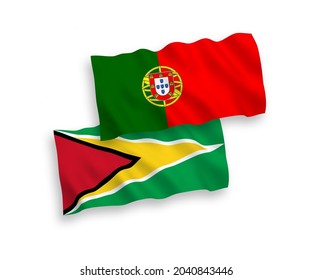 National vector fabric wave flags of Portugal and Co-operative Republic of Guyana isolated on white background. 1 to 2 proportion.