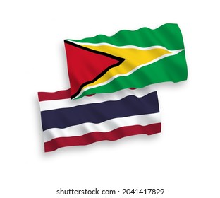 Banderas de ondulación de tela vectorial nacional de la República Cooperativa de Guyana y Tailandia aisladas sobre fondo blanco. de 1 a 2.