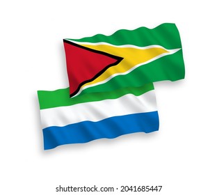 National vector fabric wave flags of Co-operative Republic of Guyana and Sierra Leone isolated on white background. 1 to 2 proportion.