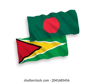 National vector fabric wave flags of Co-operative Republic of Guyana and Bangladesh isolated on white background. 1 to 2 proportion.