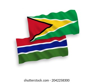 National vector fabric wave flags of Co-operative Republic of Guyana and Republic of Gambia isolated on white background. 1 to 2 proportion.