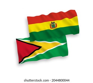 National vector fabric wave flags of Co-operative Republic of Guyana and Bolivia isolated on white background. 1 to 2 proportion.