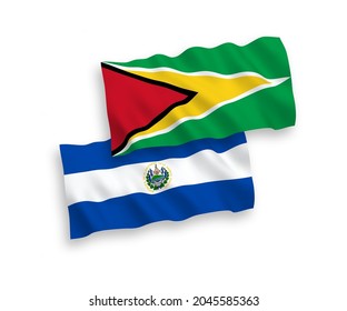 National vector fabric wave flags of Co-operative Republic of Guyana and Republic of El Salvador isolated on white background. 1 to 2 proportion.
