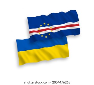 National vector fabric wave flags of Republic of Cabo Verde and Ukraine isolated on white background. 1 to 2 proportion.