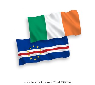 National vector fabric wave flags of Ireland and Republic of Cabo Verde isolated on white background. 1 to 2 proportion.
