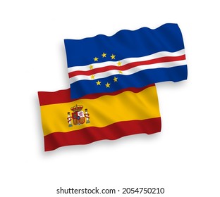 National vector fabric wave flags of Republic of Cabo Verde and Spain isolated on white background. 1 to 2 proportion.