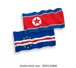 National vector fabric wave flags of North Korea and Republic of Cabo Verde isolated on white background. 1 to 2 proportion.