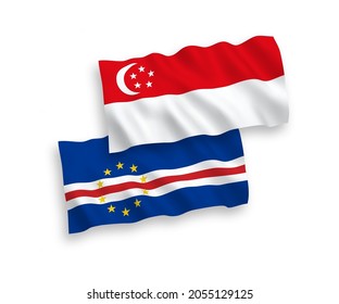 National vector fabric wave flags of Republic of Cabo Verde and Singapore isolated on white background. 1 to 2 proportion.
