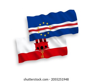 National vector fabric wave flags of Republic of Cabo Verde and Gibraltar isolated on white background. 1 to 2 proportion.