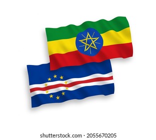 National vector fabric wave flags of Republic of Cabo Verde and Ethiopia isolated on white background. 1 to 2 proportion.