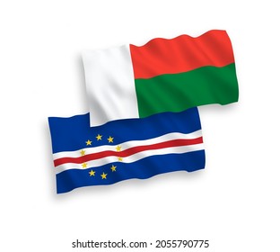 National vector fabric wave flags of Republic of Cabo Verde and Madagascar isolated on white background. 1 to 2 proportion.