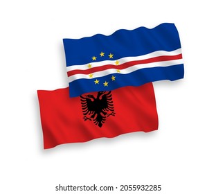 National vector fabric wave flags of Republic of Cabo Verde and Albania isolated on white background. 1 to 2 proportion.