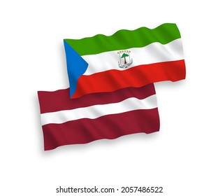 National vector fabric wave flags of Latvia and Republic of Equatorial Guinea isolated on white background. 1 to 2 proportion.
