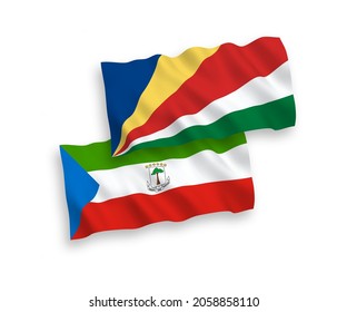 National vector fabric wave flags of Republic of Equatorial Guinea and Seychelles isolated on white background. 1 to 2 proportion.