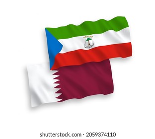 National vector fabric wave flags of Republic of Equatorial Guinea and Qatar isolated on white background. 1 to 2 proportion.
