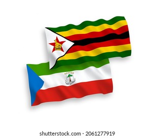 National vector fabric wave flags of Republic of Equatorial Guinea and Zimbabwe isolated on white background. 1 to 2 proportion.