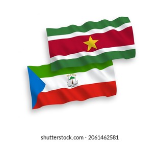 National vector fabric wave flags of Republic of Equatorial Guinea and Republic of Suriname isolated on white background. 1 to 2 proportion.