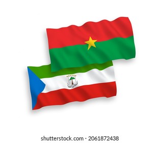 National vector fabric wave flags of Republic of Equatorial Guinea and Burkina Faso isolated on white background. 1 to 2 proportion.