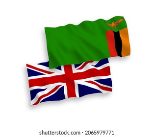 National vector fabric wave flags of Great Britain and Republic of Zambia isolated on white background. 1 to 2 proportion.