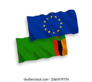 National vector fabric wave flags of European Union and Republic of Zambia isolated on white background. 1 to 2 proportion.
