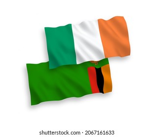 National vector fabric wave flags of Ireland and Republic of Zambia isolated on white background. 1 to 2 proportion.