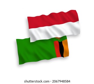 National vector fabric wave flags of Indonesia and Republic of Zambia isolated on white background. 1 to 2 proportion.