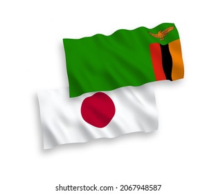 National vector fabric wave flags of Japan and Republic of Zambia isolated on white background. 1 to 2 proportion.