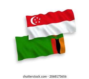 National vector fabric wave flags of Republic of Zambia and Singapore isolated on white background. 1 to 2 proportion.