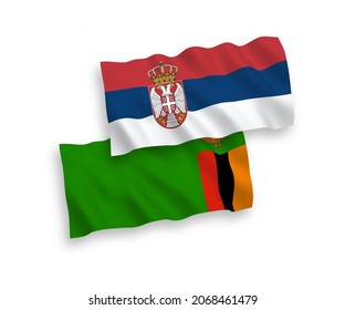 National vector fabric wave flags of Republic of Zambia and Serbia isolated on white background. 1 to 2 proportion.