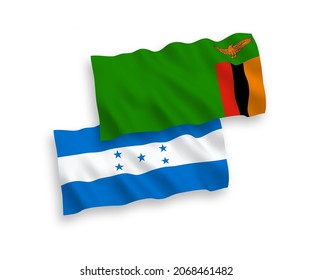 Banderas de olas de tela vectorial nacional de la República de Zambia y Honduras aisladas en fondo blanco. de 1 a 2.
