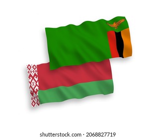 National vector fabric wave flags of Republic of Zambia and Belarus isolated on white background. 1 to 2 proportion.