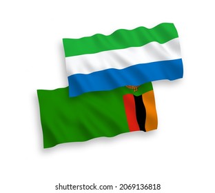 National vector fabric wave flags of Republic of Zambia and Sierra Leone isolated on white background. 1 to 2 proportion.