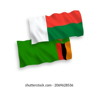 Nationale Vektor-Wellen-Flaggen der Republik Sambia und Madagaskar einzeln auf weißem Hintergrund. 1 bis 2 %.
