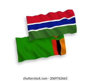 National vector fabric wave flags of Republic of Zambia and Republic of Gambia isolated on white background. 1 to 2 proportion.